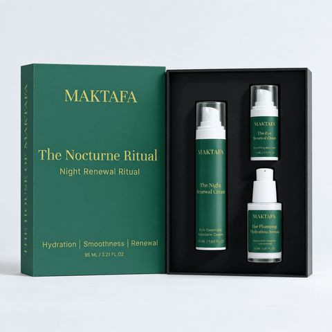 The Nocturne Ritual: three products fitted inside an open black presentation box, beside its emerald lid.