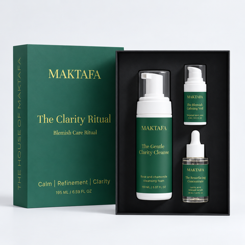 The Clarity Ritual: three products fitted inside an open black presentation box, beside its emerald lid.