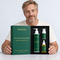 A person presenting the open Ember Renewal Ritual box with all three products visible.