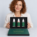 A person presenting the open The Renewal Ritual box with all three products visible.