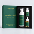 The Radiance Ritual: three products fitted inside an open black presentation box, beside its emerald lid.