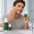 Person applying face cream to a cheek, with the Hydration Ritual products beside the basin.