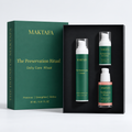 The Preservation Ritual: three products fitted inside an open black presentation box, beside its emerald lid.
