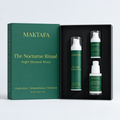 The Nocturne Ritual: three products fitted inside an open black presentation box, beside its emerald lid.