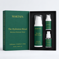 The Hydration Ritual: three products fitted inside an open black presentation box, beside its emerald lid.