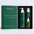 The Ember Renewal Ritual: three products fitted inside an open black presentation box, beside its emerald lid.