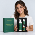 A person presenting the open The Radiance Ritual box with all three products visible.