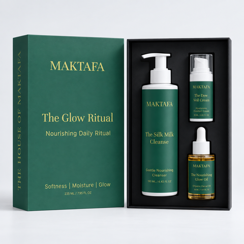 The Glow Ritual: three products fitted inside an open black presentation box, beside its emerald lid.