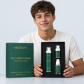 A person presenting the open The Comfort Ritual box with all three products visible.